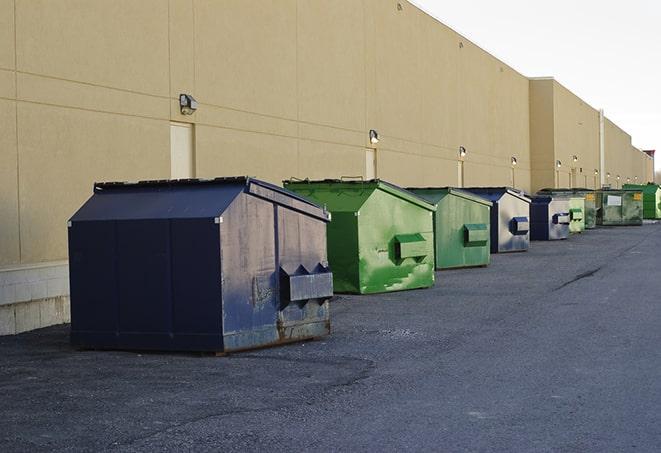 construction dumpsters stacked in a row on a job site in Billerica